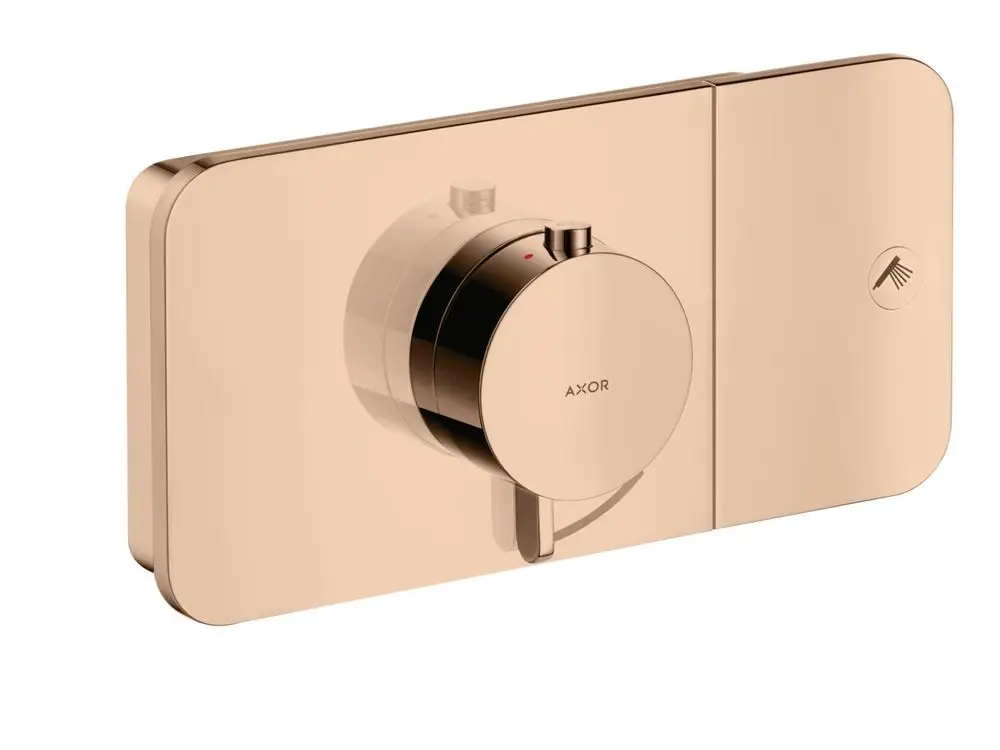 Thermostatmodul in Polished Red Gold von AXOR, unterputz montiert, mit einem Bedienknopf und einem Symbol für die Wasserzufuhr.